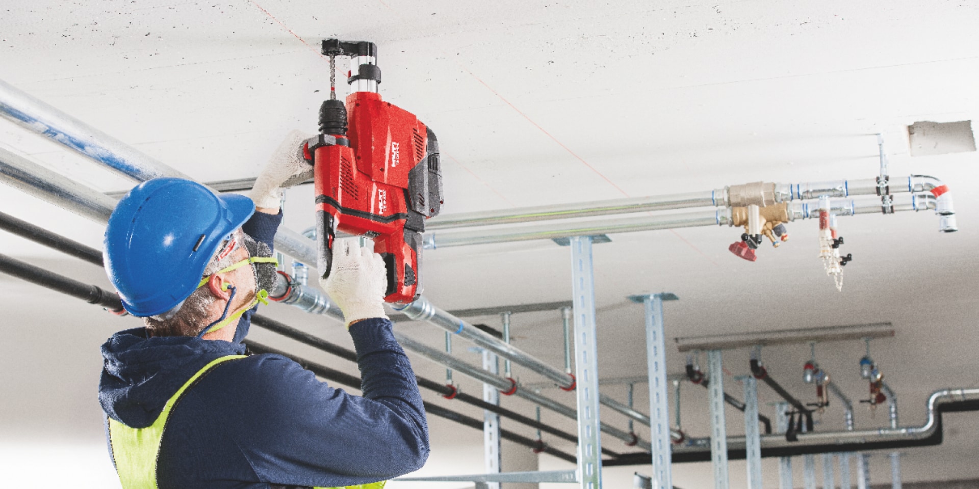 TE 6-A22 cordless rotary hammer being used with an integrated dust removal system