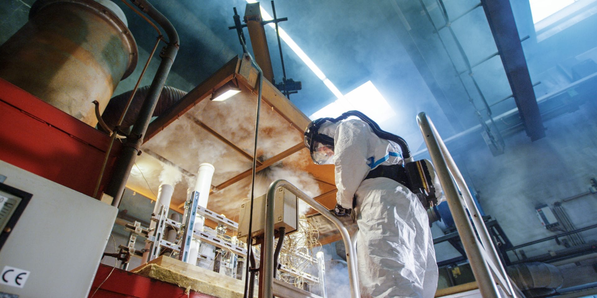 Image of a firestop engineer carrying out a firestop text in laboratory conditions