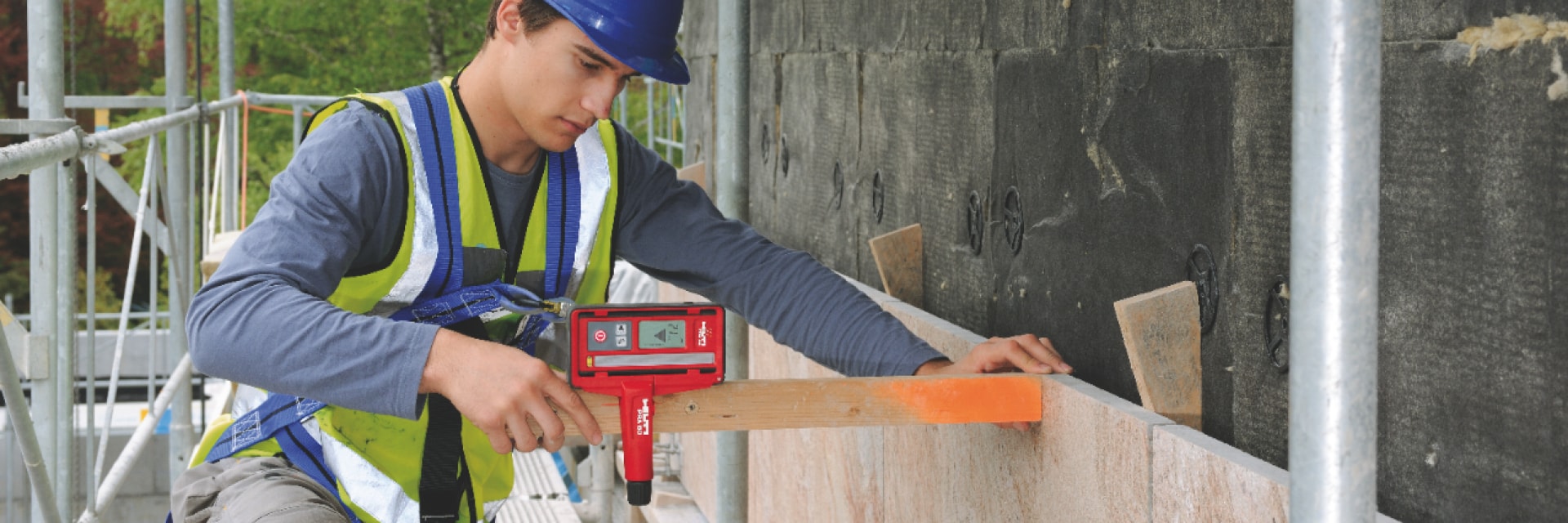 Construction worker using a Hilti tool