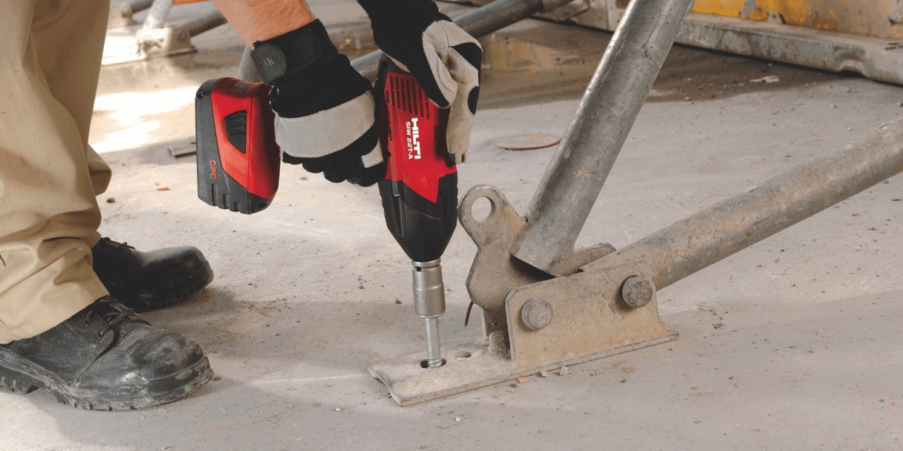 man using Hilti's hex head screw anchors