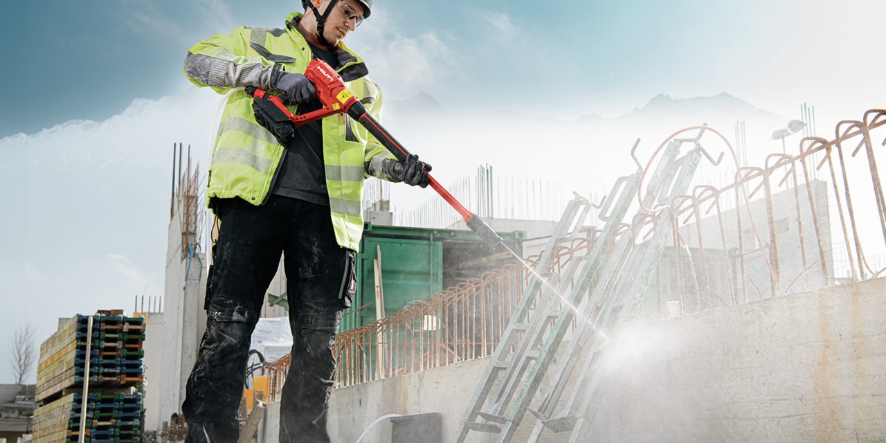 man using Hilti's cordless pressure cleaner